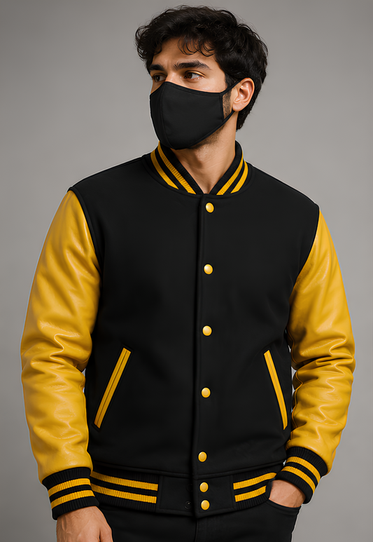 Person wearing a black and yellow varsity jacket with a gray background