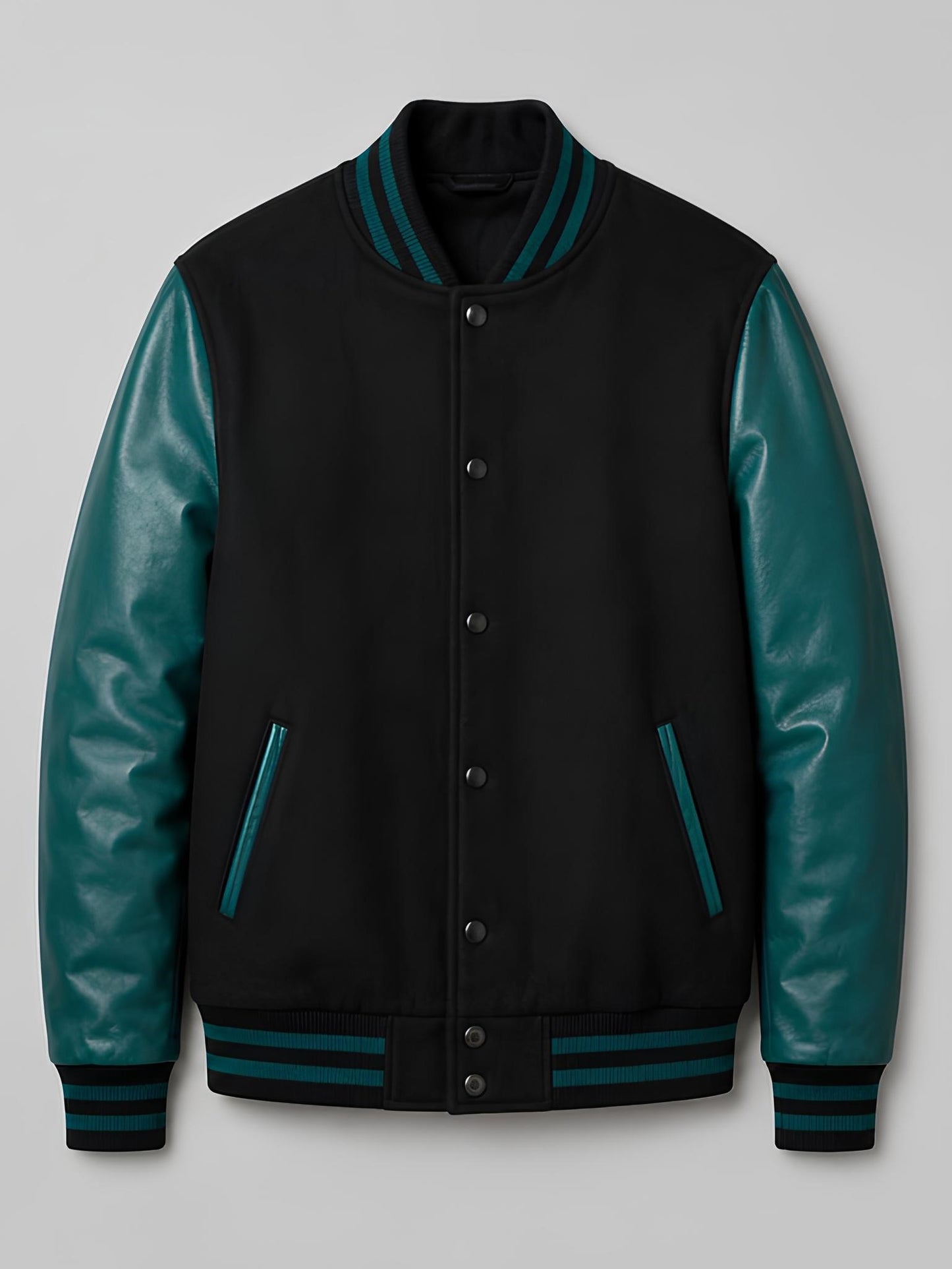 Black varsity jacket with teal sleeves on a light gray background