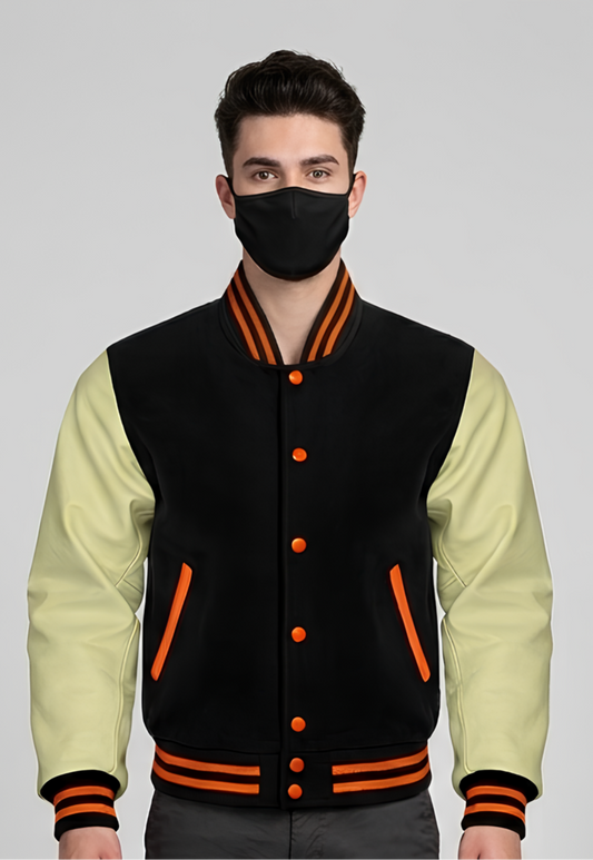 Person wearing a black and cream varsity jacket with orange accents on a gray background