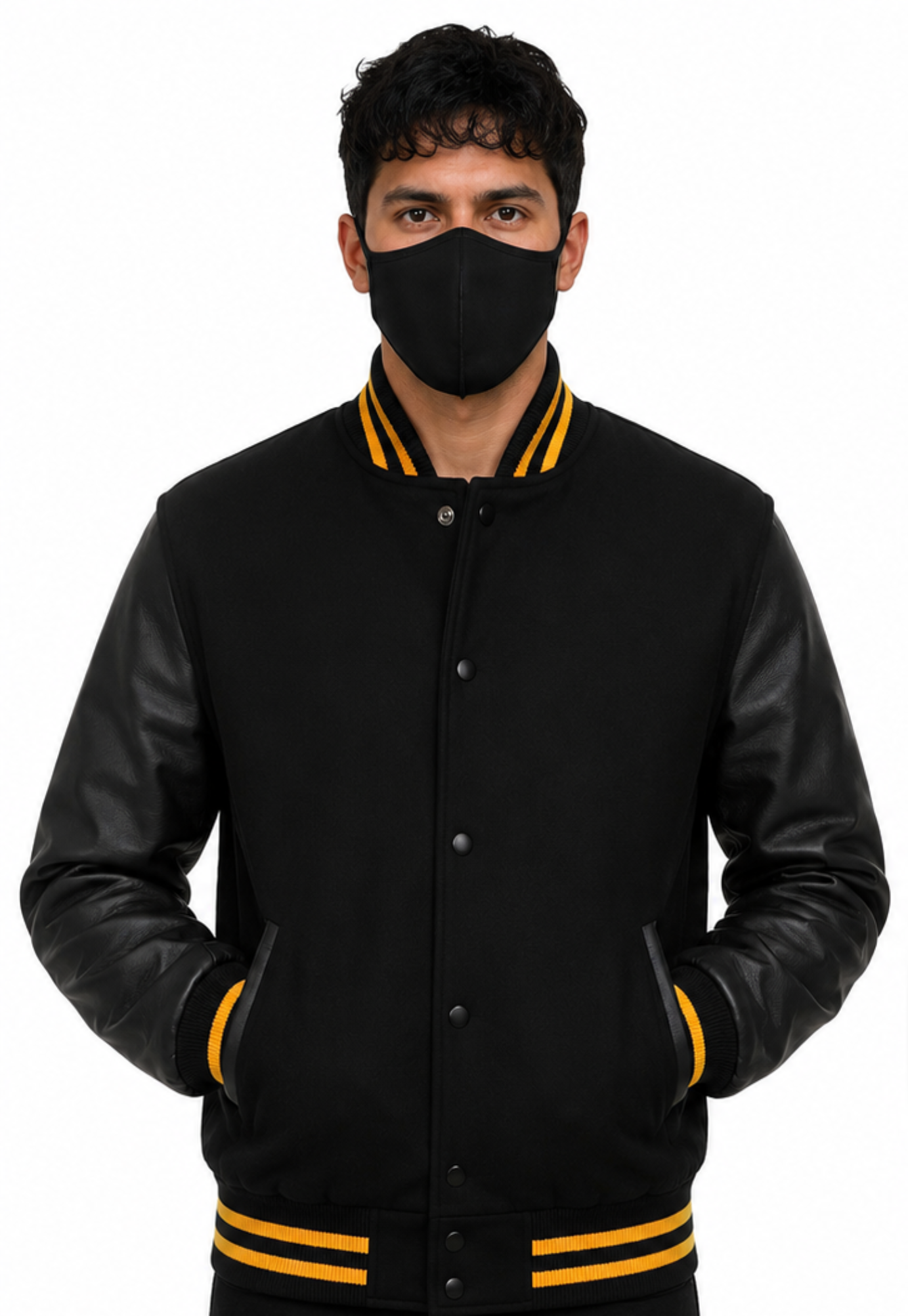 Person wearing a black varsity jacket with yellow accents and a black face mask on a white background